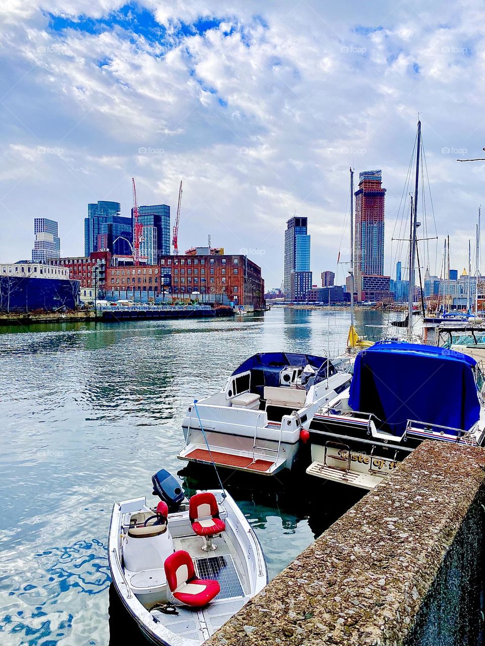 The East River at Newtown Creek in Long Island City, Queens, NY with various boats photographed from beneath the Pulaski Bridge in December 2021. Hypnotic Productions