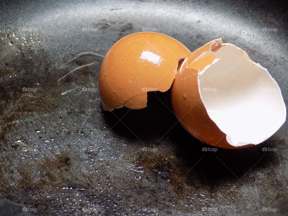 Egg shells on a frying pan