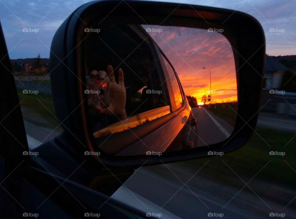 beautiful sunrise view during road trip and window shoot through mirror