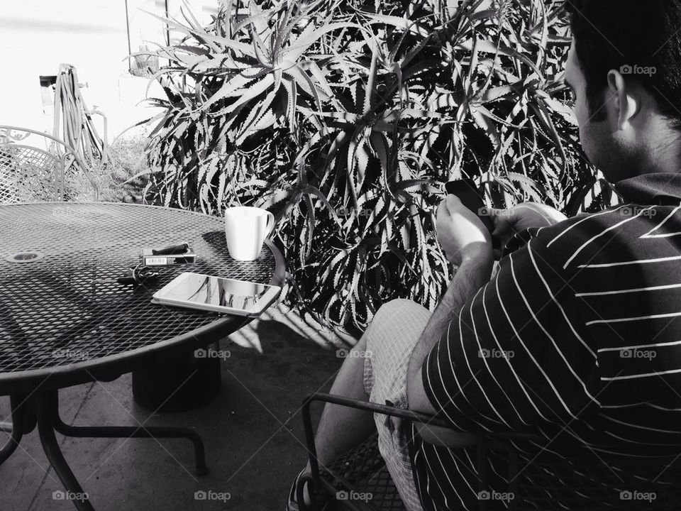 Man at outdoor table