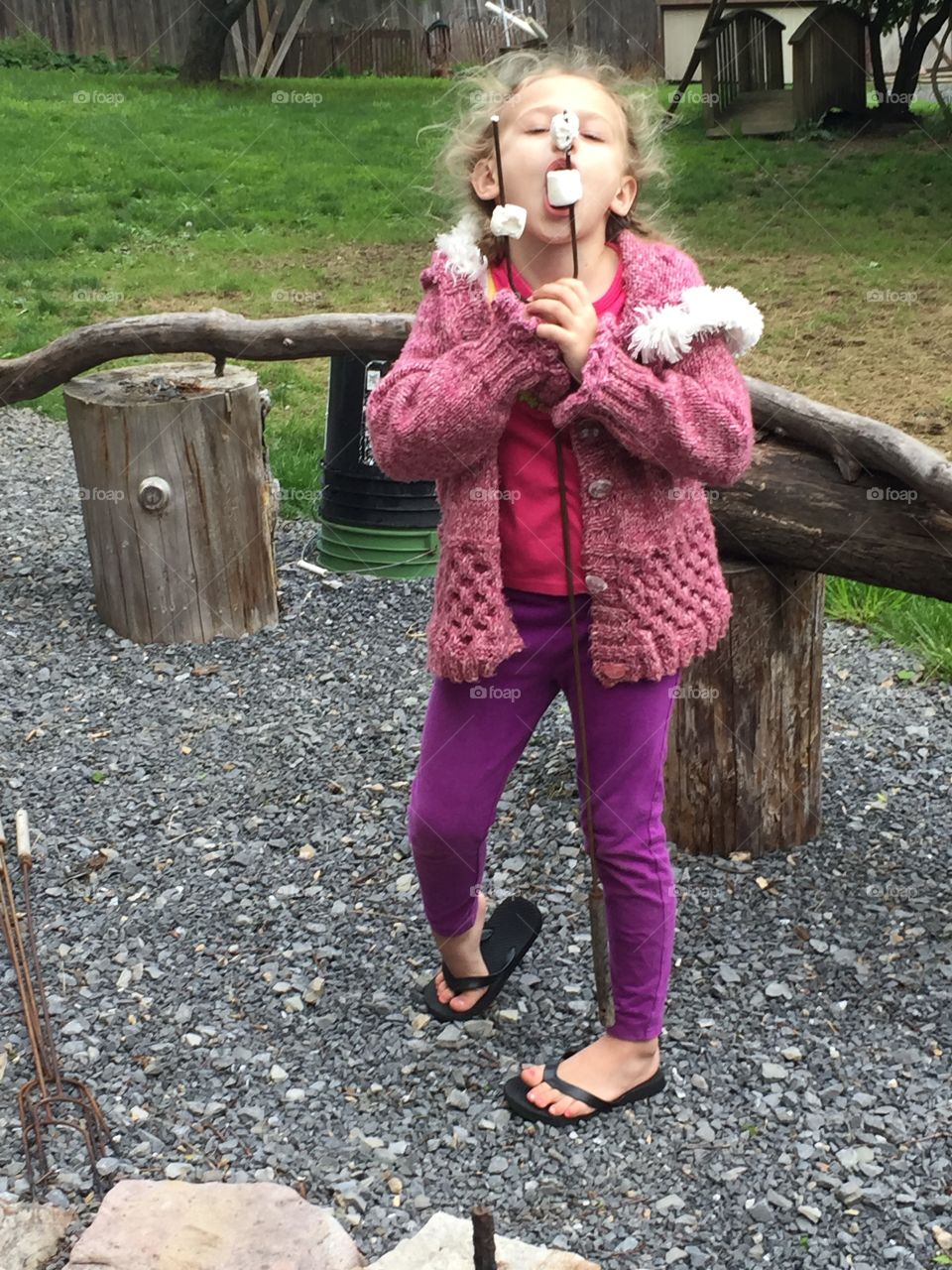 Girl eating marshmallow