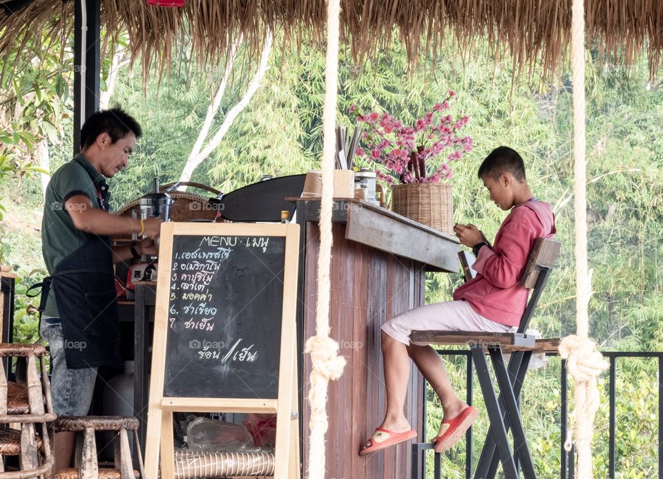 Father and son at coffee shop