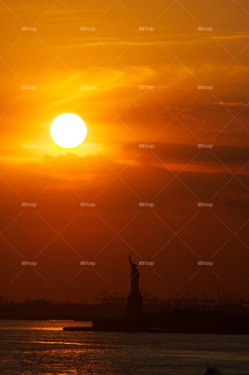 Sunset over Statue of Liberty 