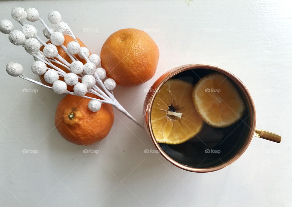 Close up of black tea and orange