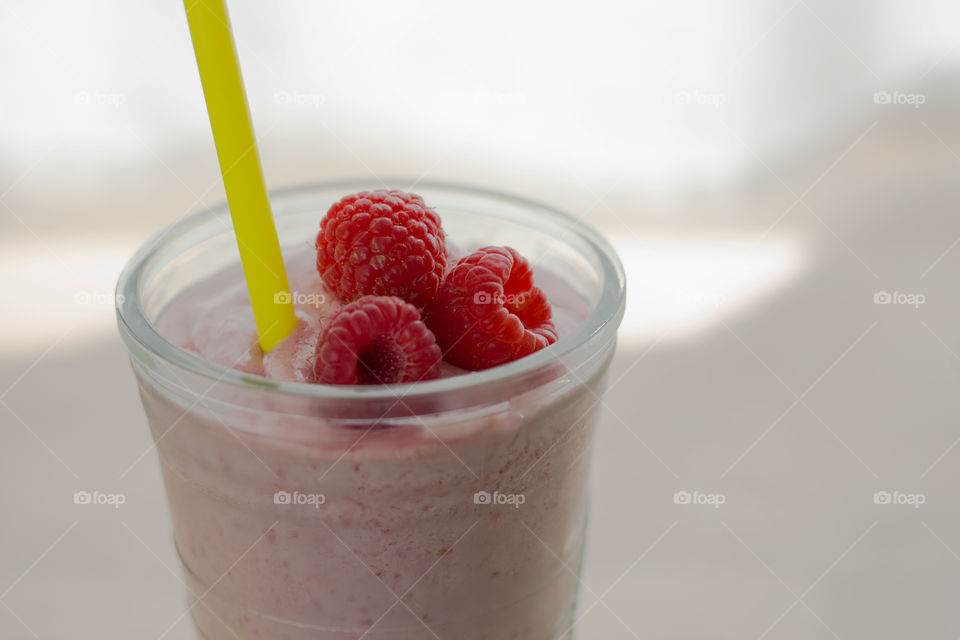 Close-up of raspberry smoothie in glass