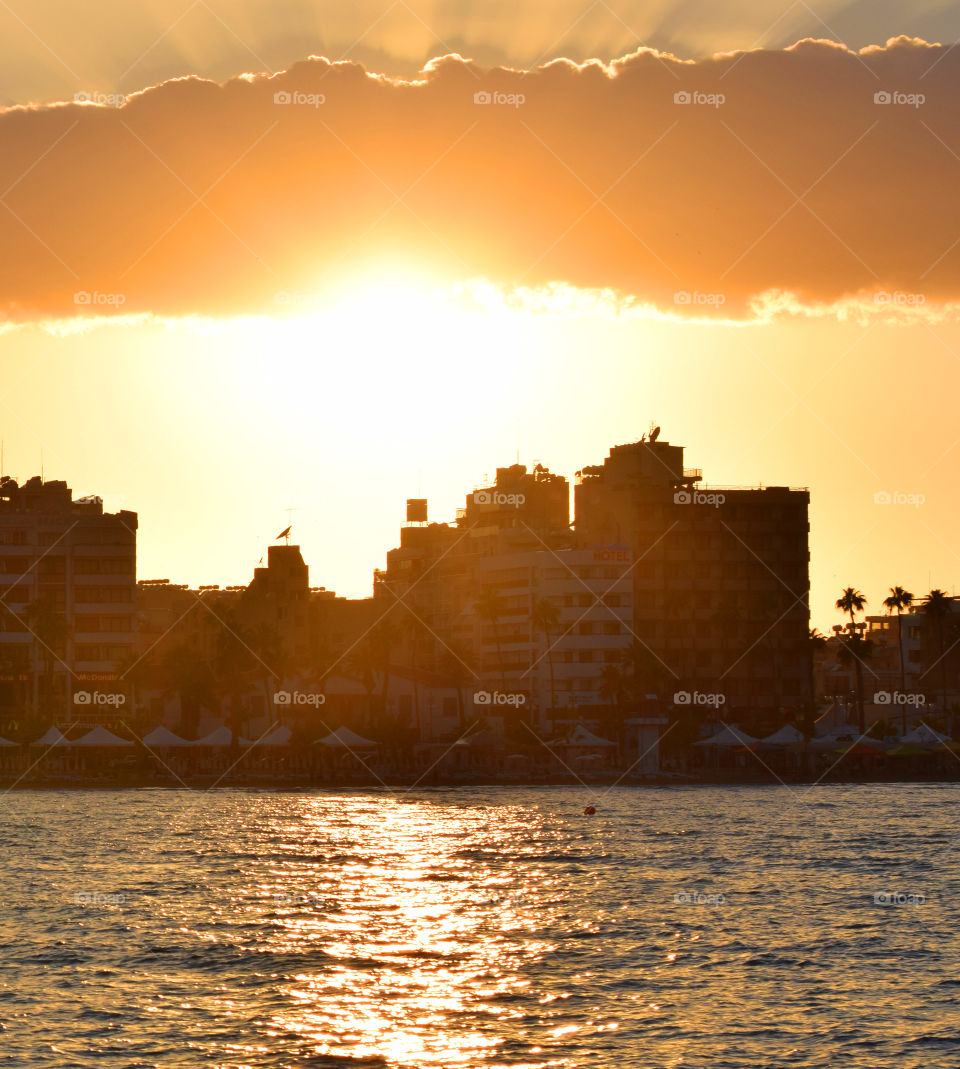 sunset building sea