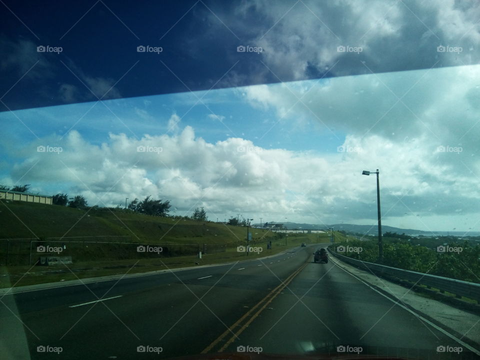 road clouds sky