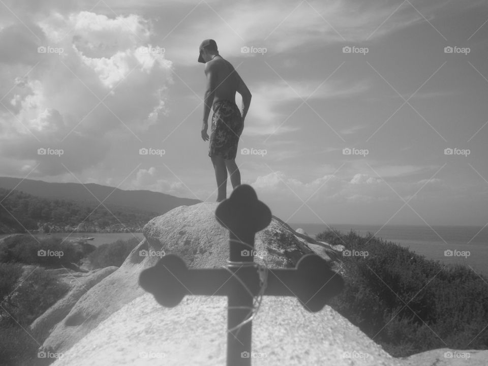 man standing on the rock