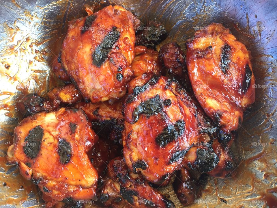 This is a very well seasoned and marinated sweet and spicy bbq chicken. The meat was cooked several different ways to creat a juicy tender and savory taste with outstanding texture. Enjoy the photo!