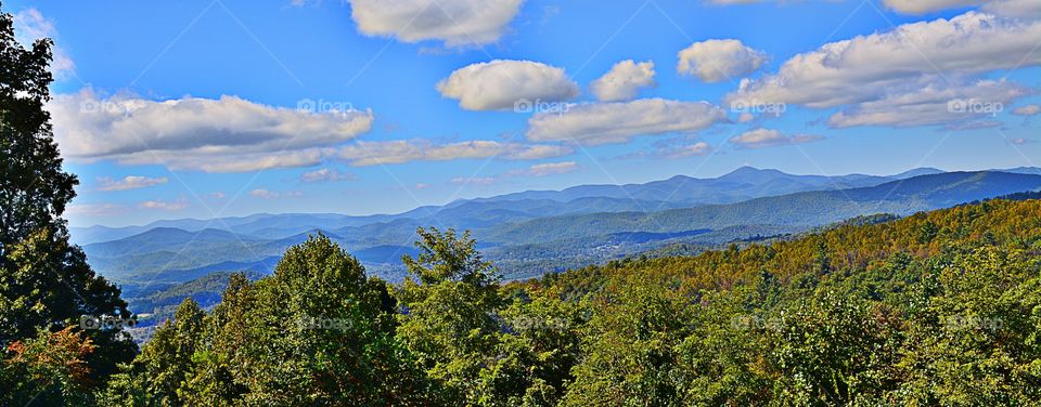 Mountain range against cloudy sky