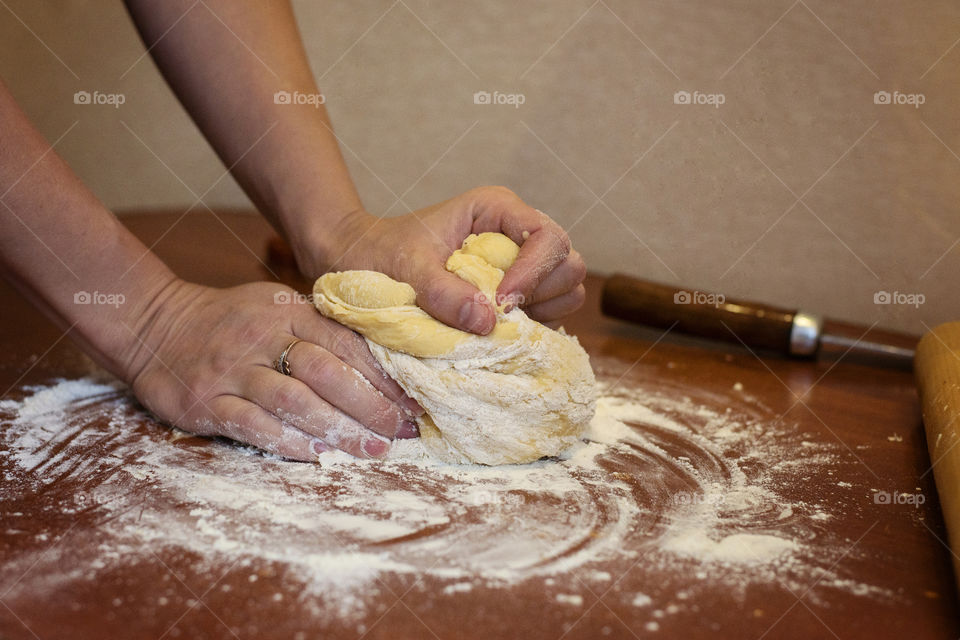 Women kneading the dough