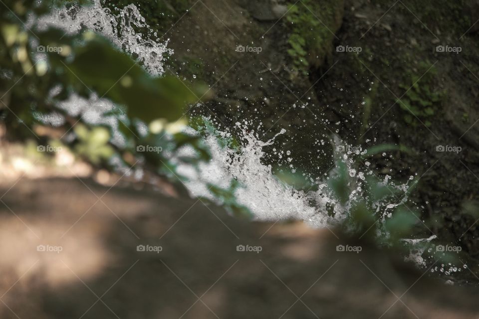 Flowing water a top a waterfall