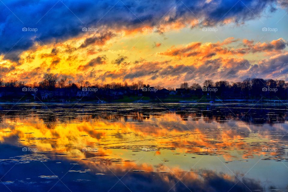 A beautiful sunset on the lake in Indiana in winter. 