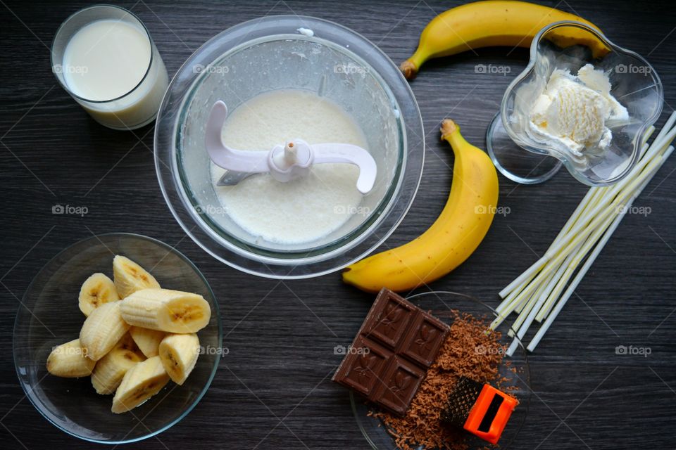 Preparating milk shake with banana