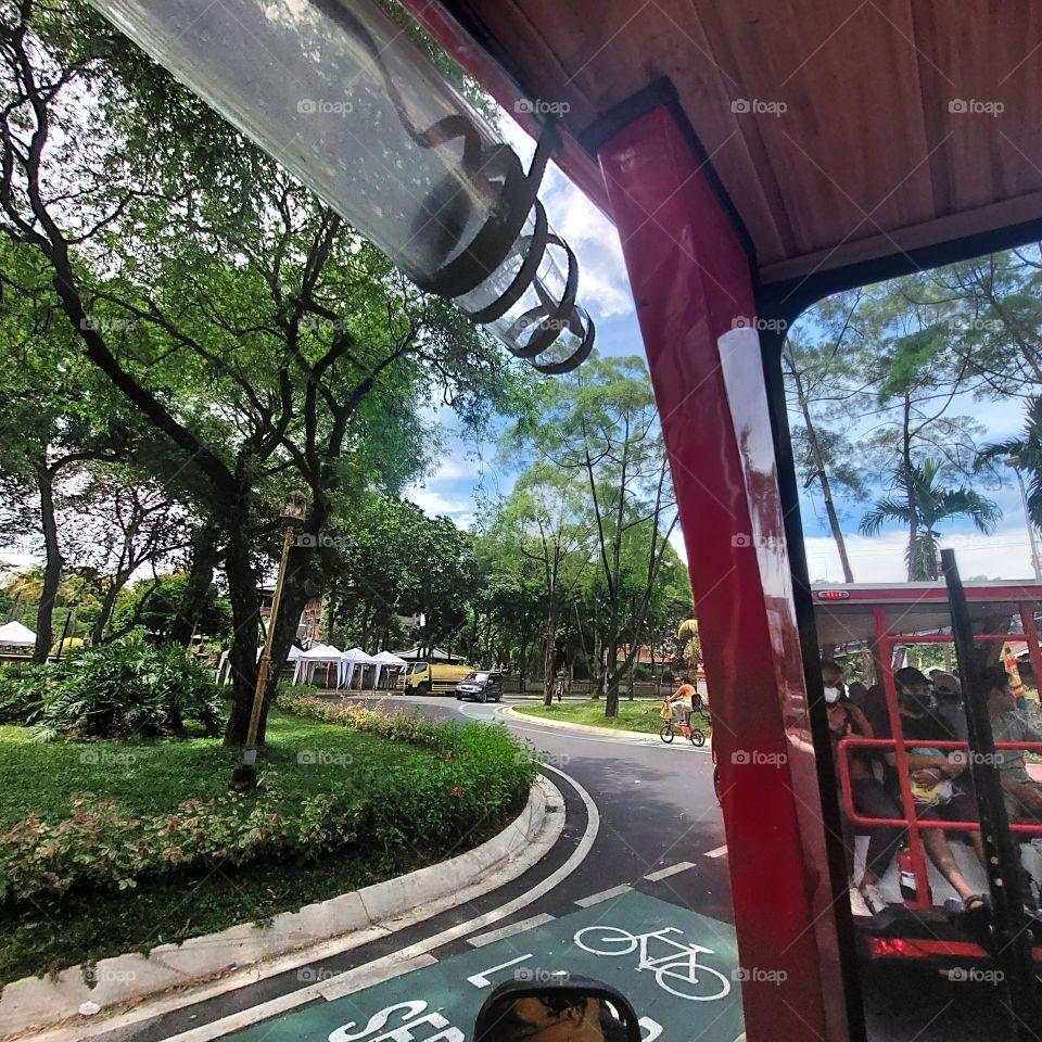 traveling by electric vehicle on empty streets with bicycle lanes on the side