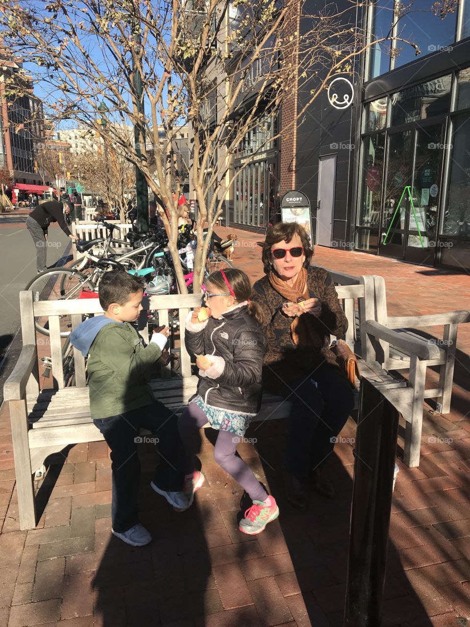 Family enjoying Washington DC - Perfect weather & no posing —Happy because just go cupcakes from famous DC Cupcake Shop