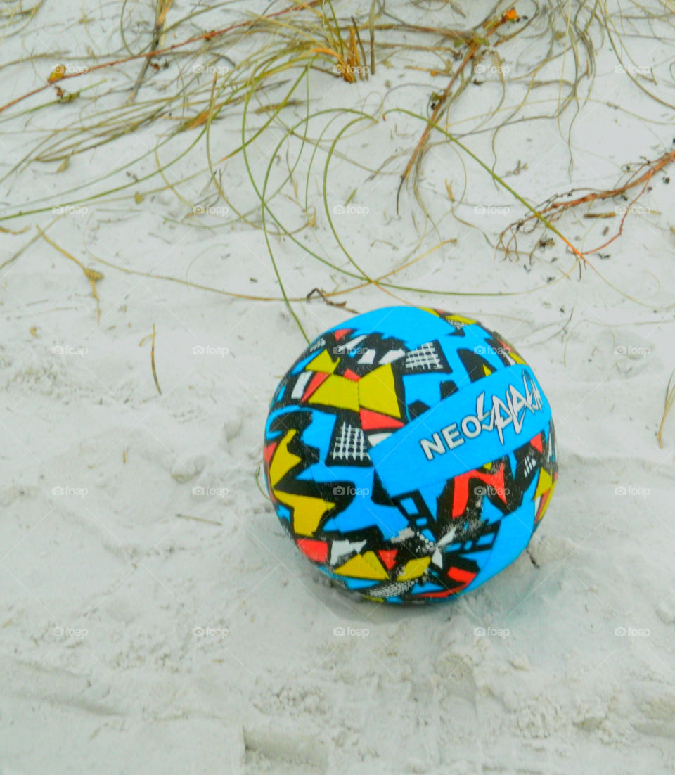 Come play with me!
Kids soccer ball resting in the sandy beach on the Gulf of Mexico!