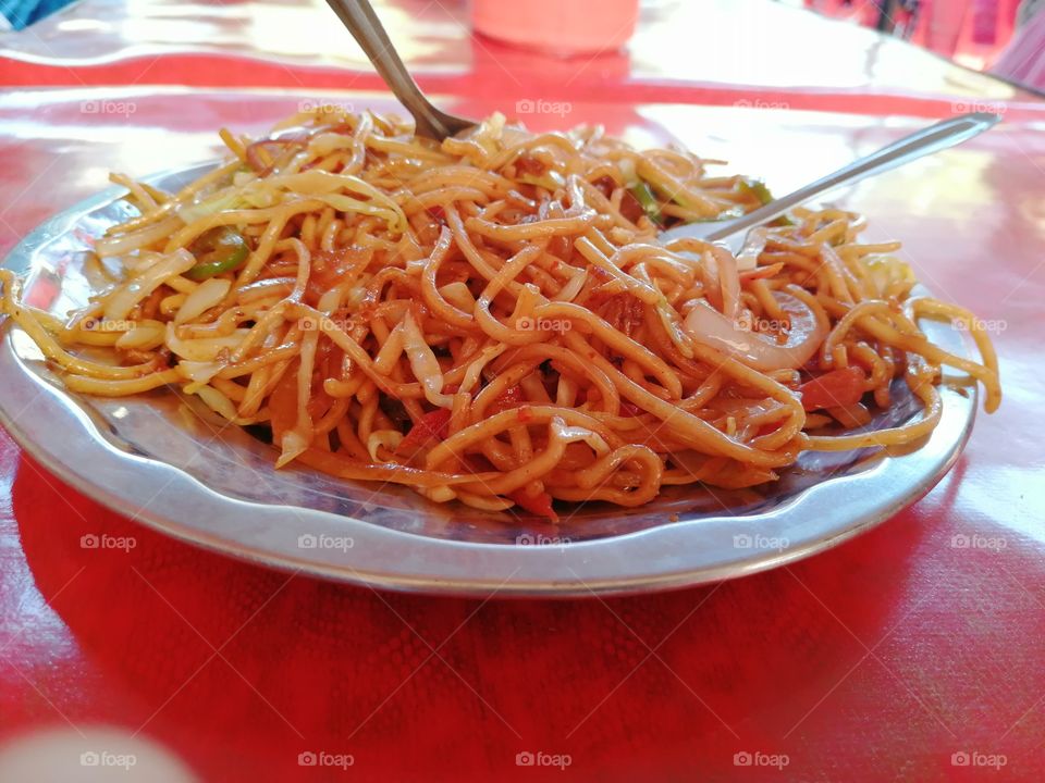 Famous Street Food in India noodles or chowmins.