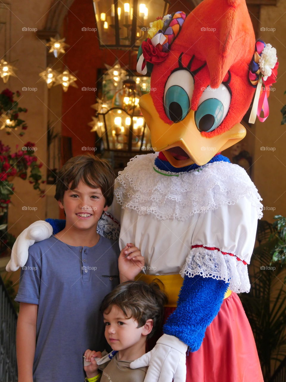 Portrait of female duck costume with two children