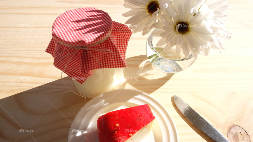 Milk and cheese on table