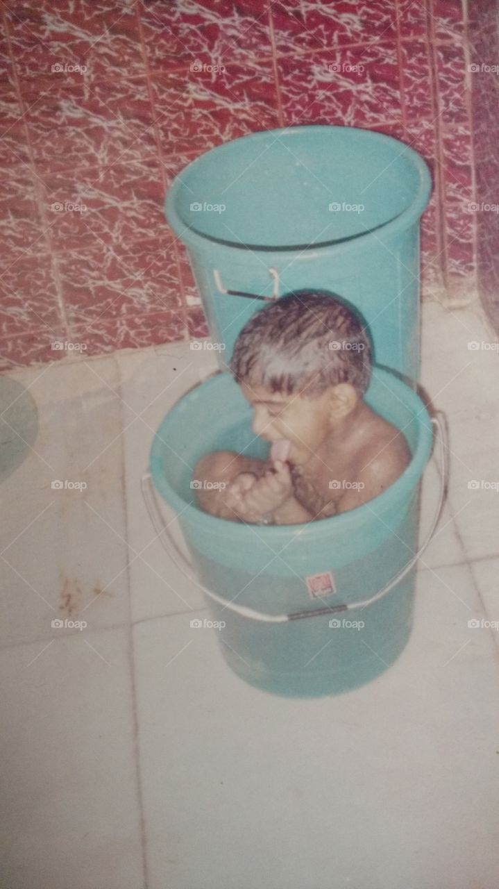 Kid in a bucket.