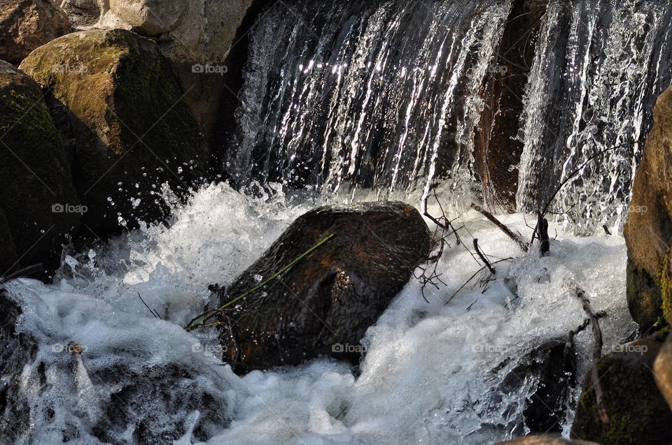 waterfall and river in the spring park in Poland