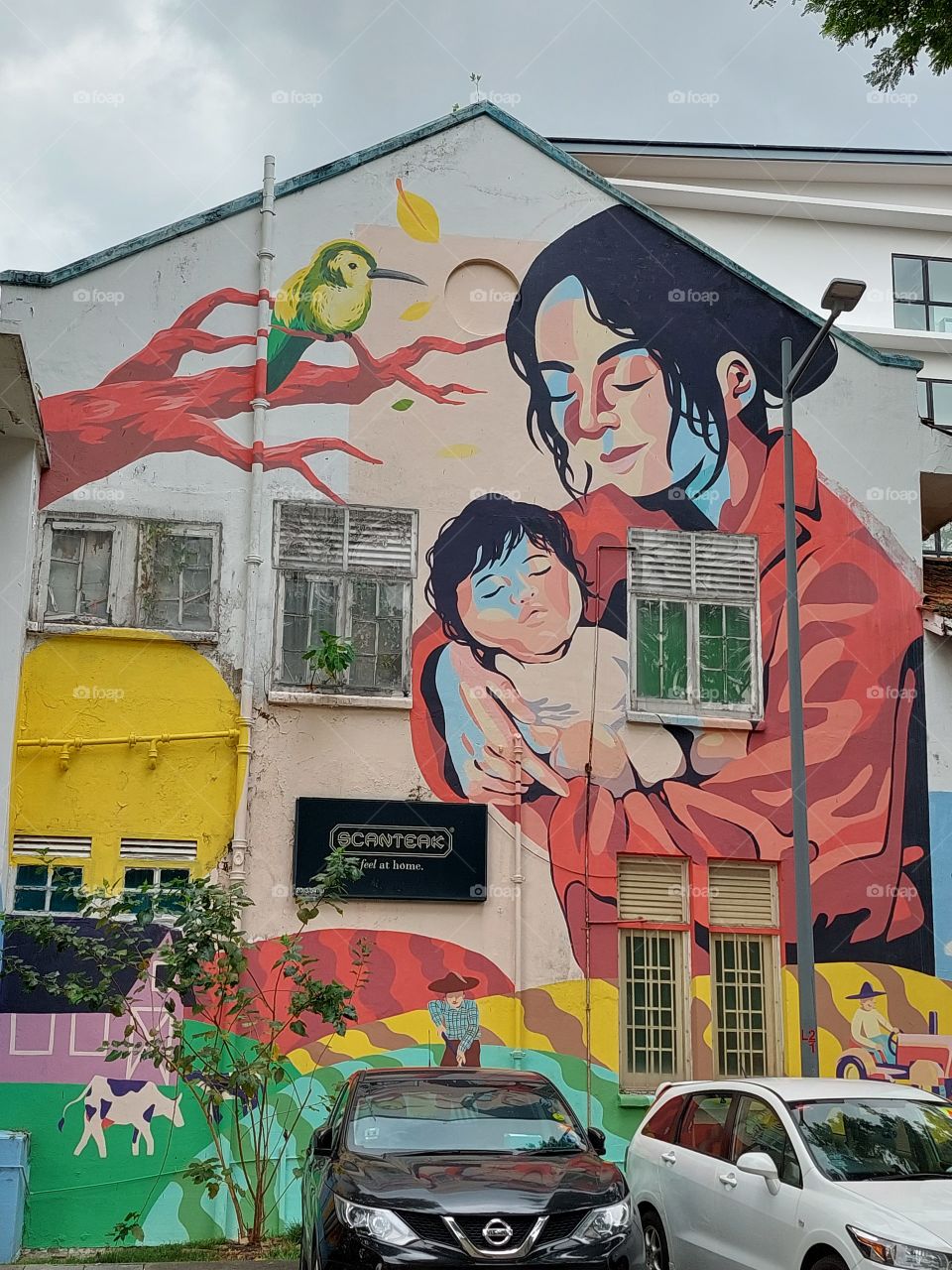 wall paiting of mother and baby