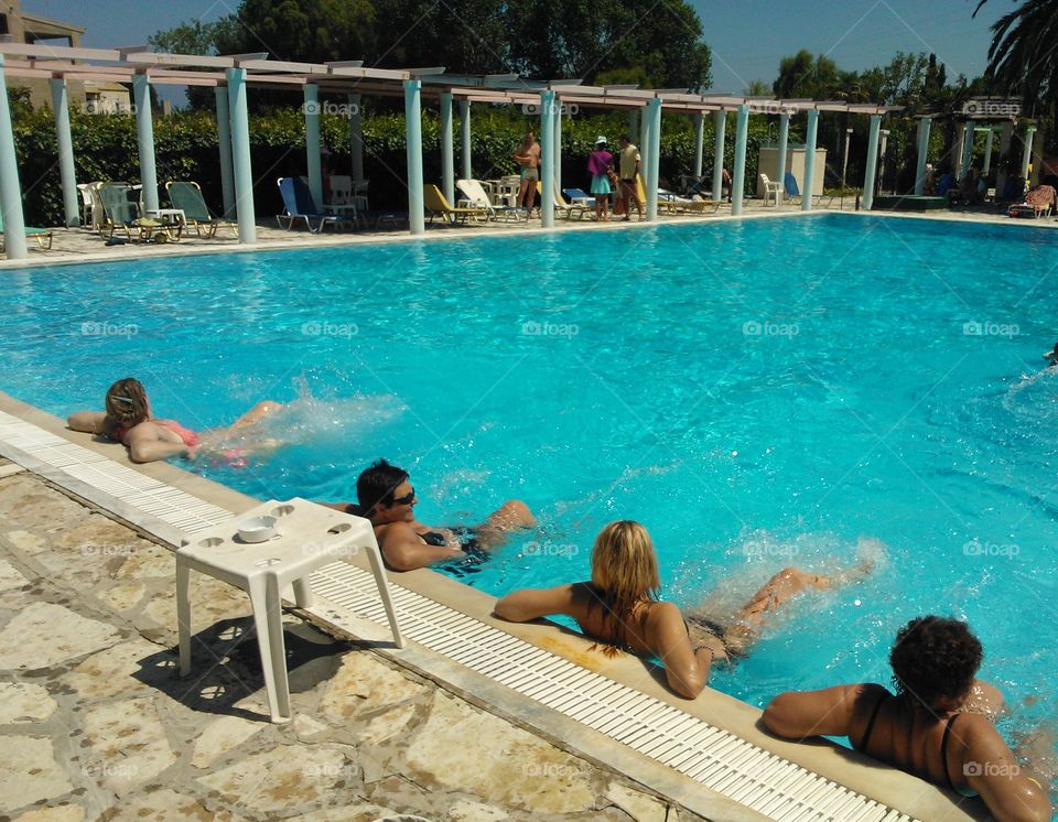 People enjoying in swimming pool