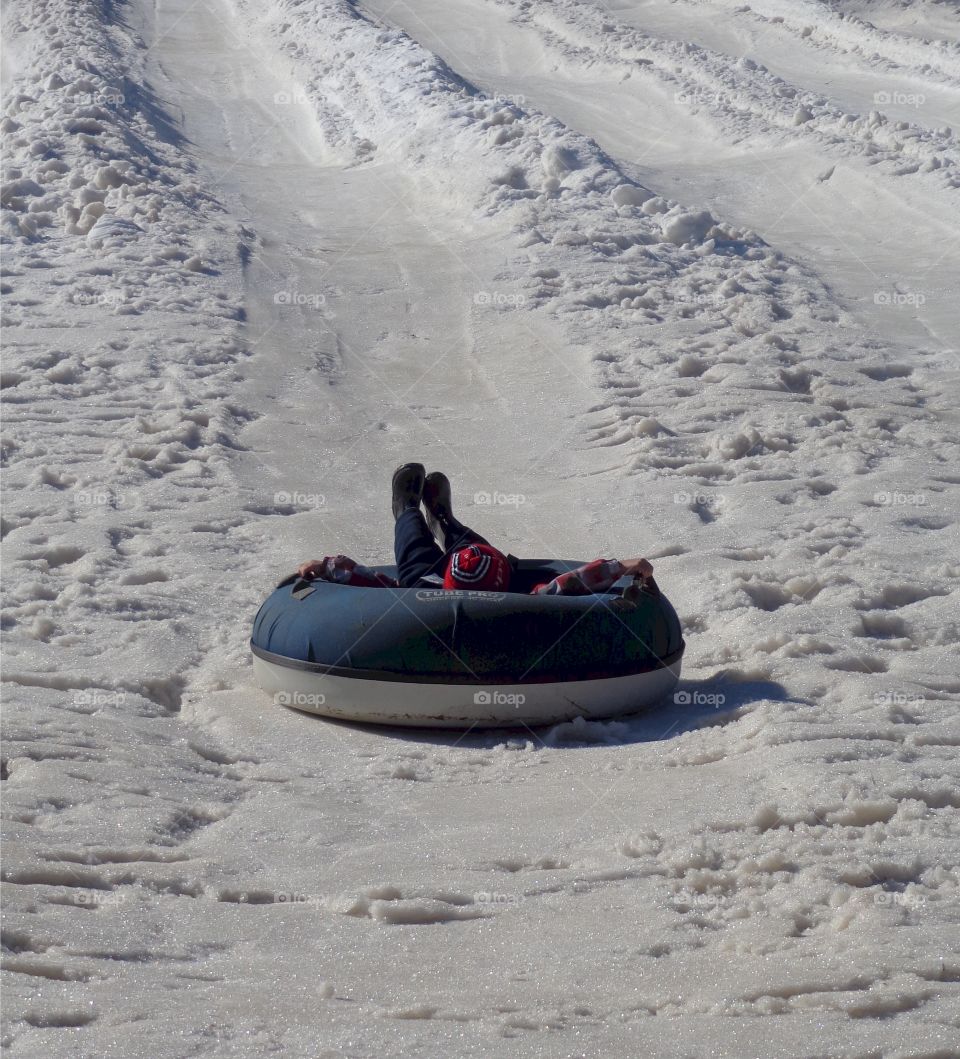 snow tubing backwards . can't steer it anyway 