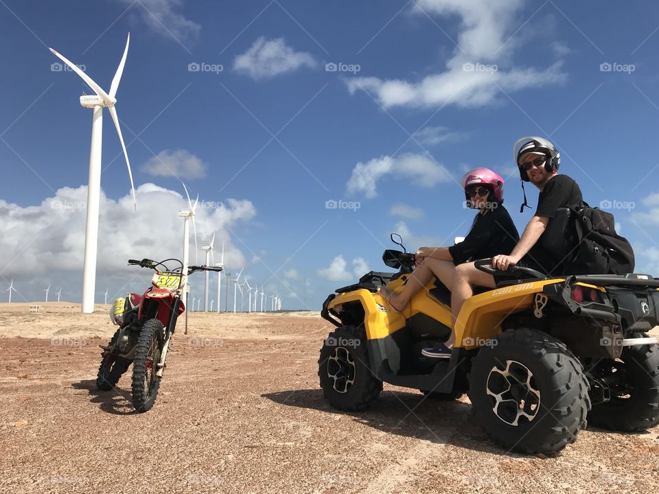 Couple having Fun with a quadbike at dunes Ceará Brazil