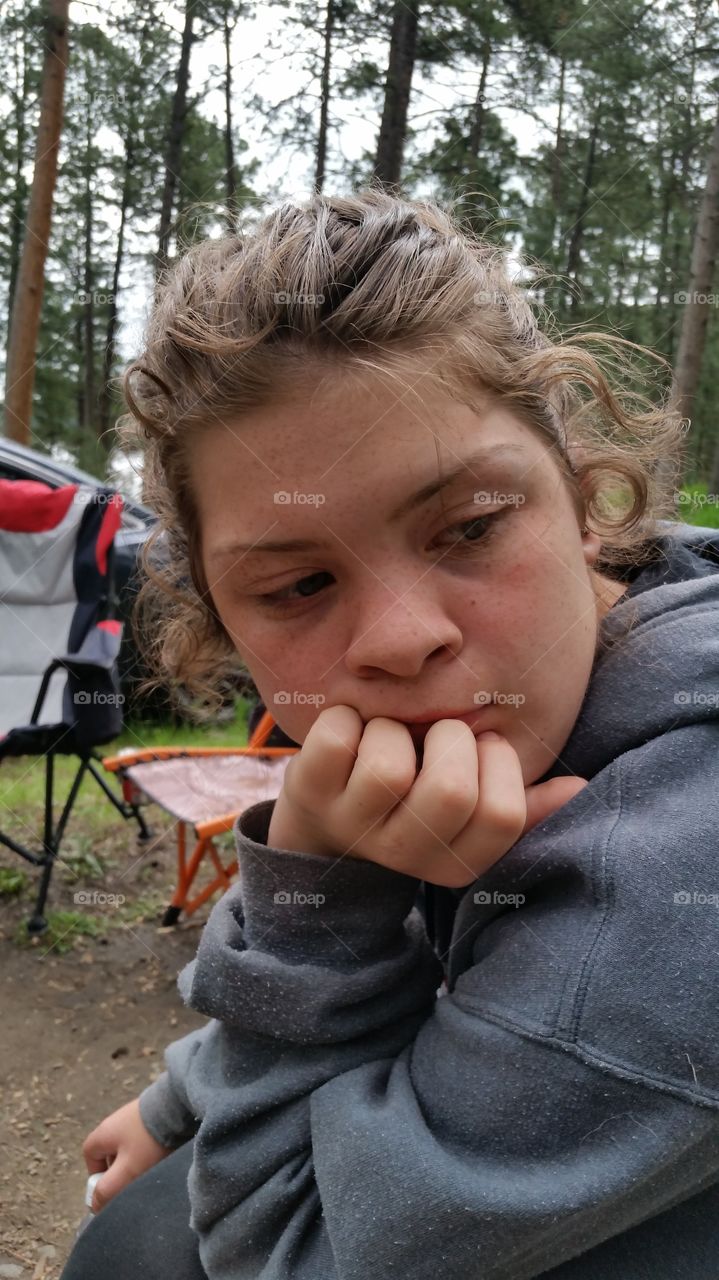 my beautiful daughter contimplating life, while camping in South Dakota. It's tough being a teenager.