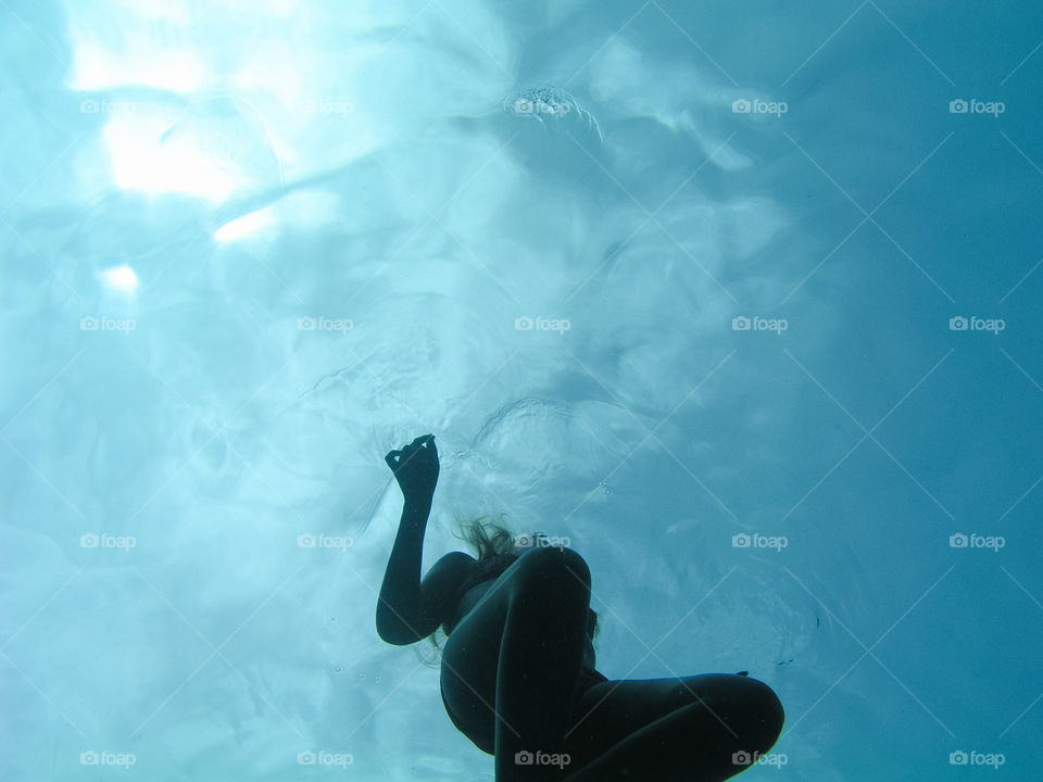 Young woman swiming underwater in Red Sea or Ocean