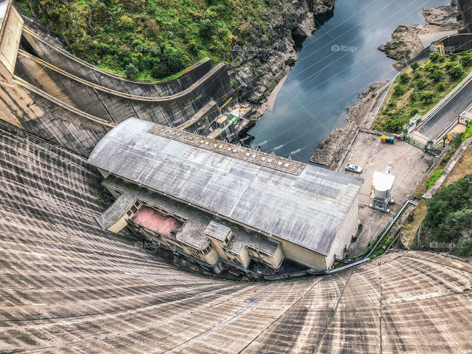 Steep view down the Castelo Do Bode dam to the  river,  Martinchel, Portugal - March 2019