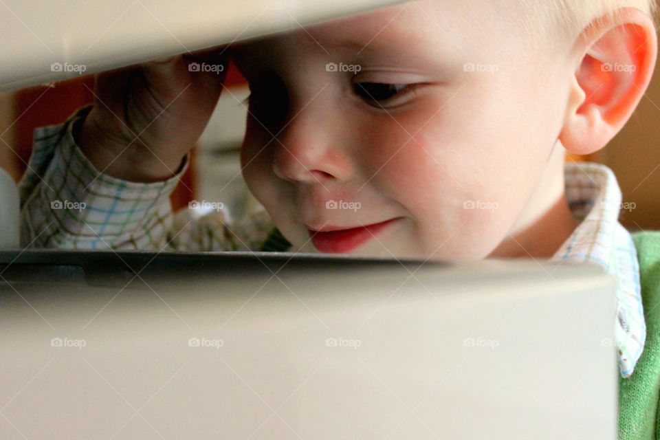 Curious kid looking in the box