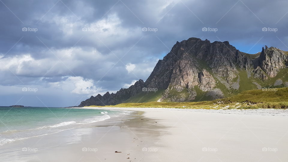 A beautiful beach with a mountain in background. Bleik. Norway.