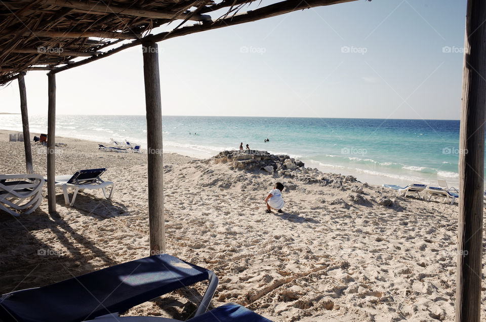 a boy playing on the beach