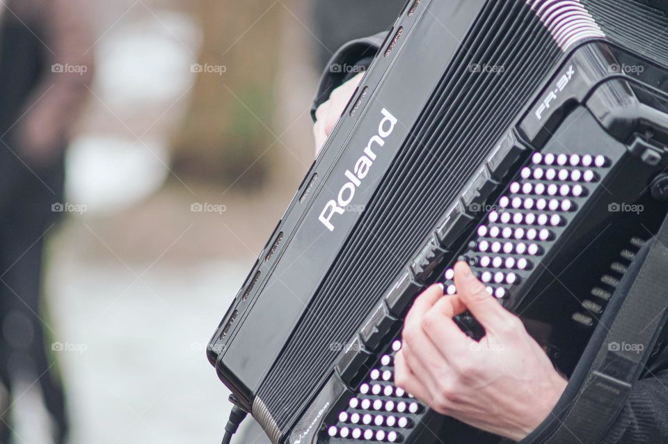 Man playing bojan on the street