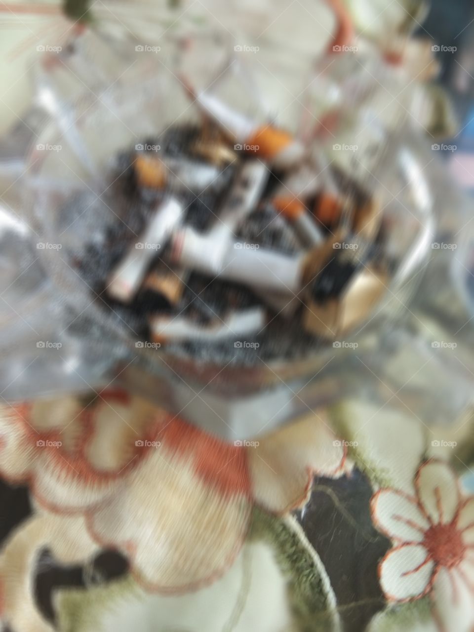 blur photos of ashtrays with cigarette butts