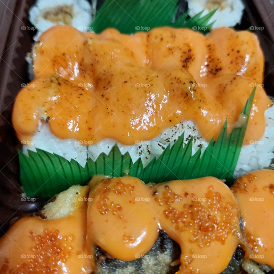 assorted sushi served in a container