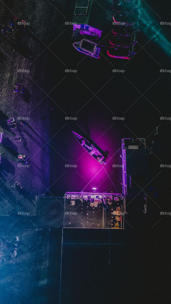 Pink Boat in harbor during the night.