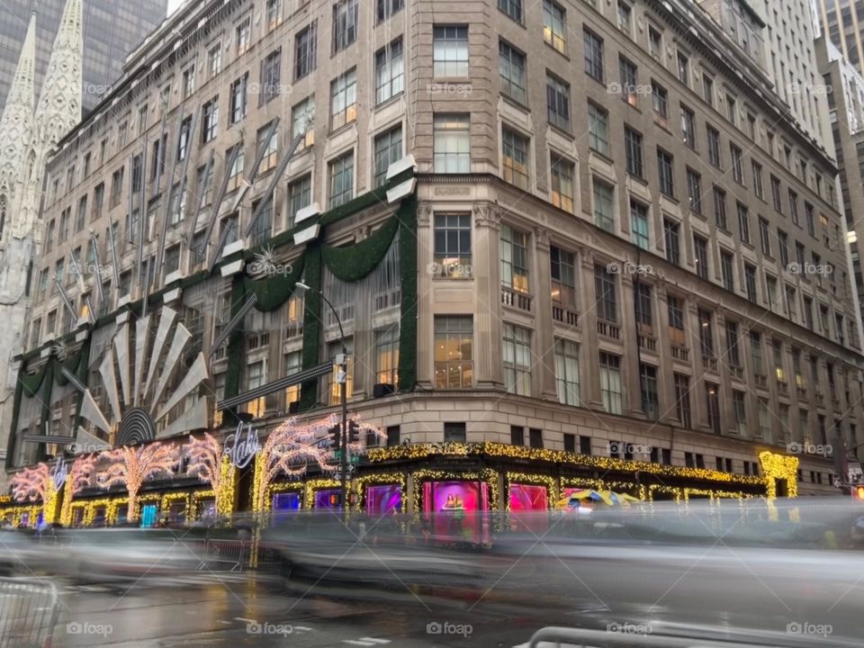 Long exposure photo of moving traffic at 5th Avenue in NYC during holiday season 