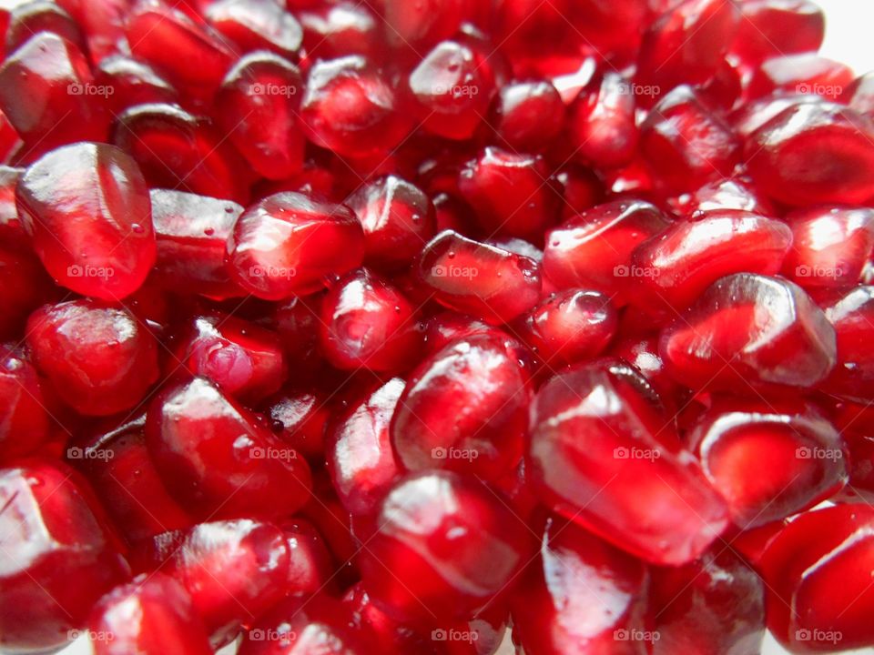 red pomegranate seeds healthy food texture background