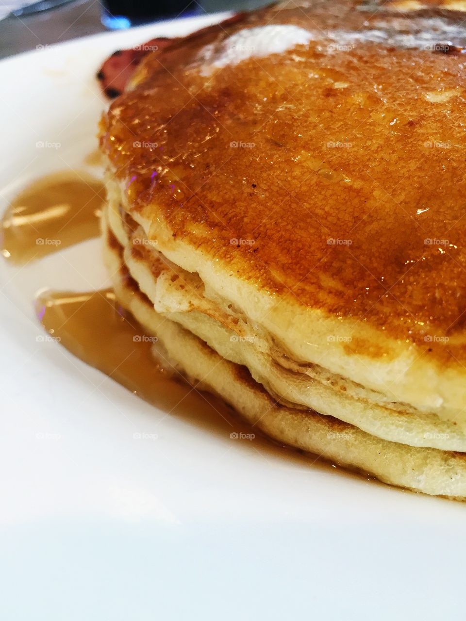 Macro shot of pancakes with syrup