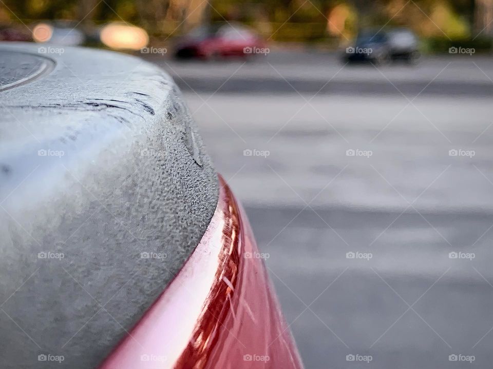 Commuting: cars, vehicles parked and ready to come in or leave seen from the back bed of a red pick up truck.