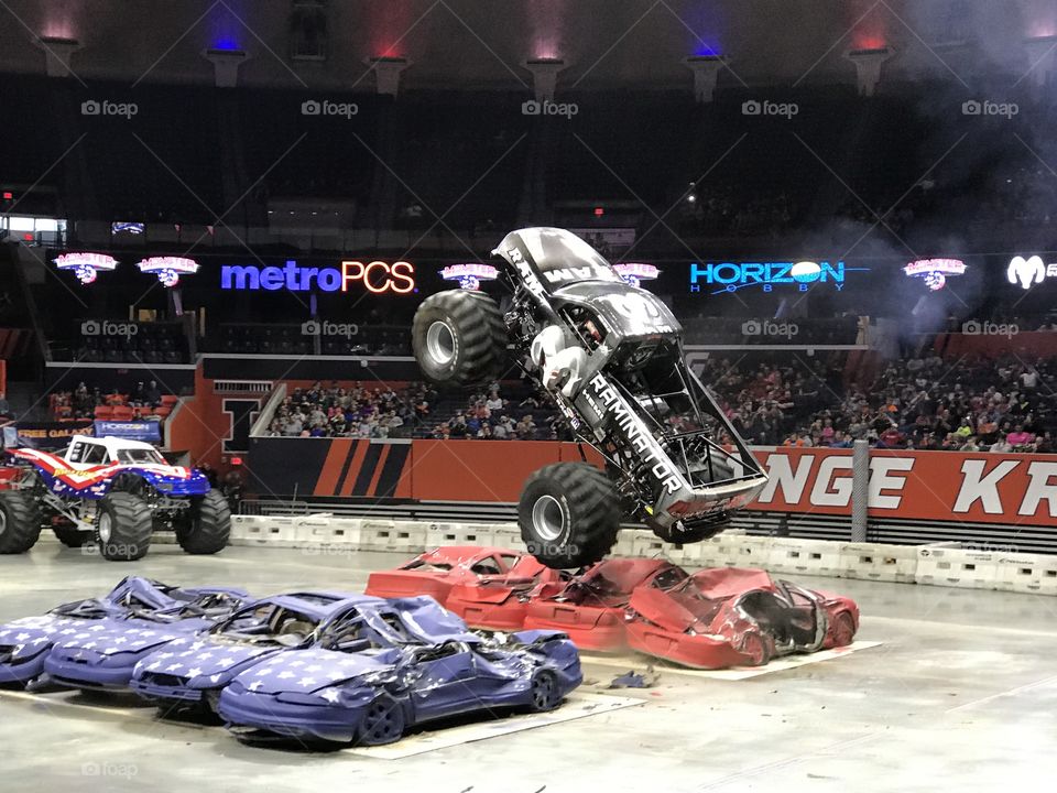 Monster truck jumping cars