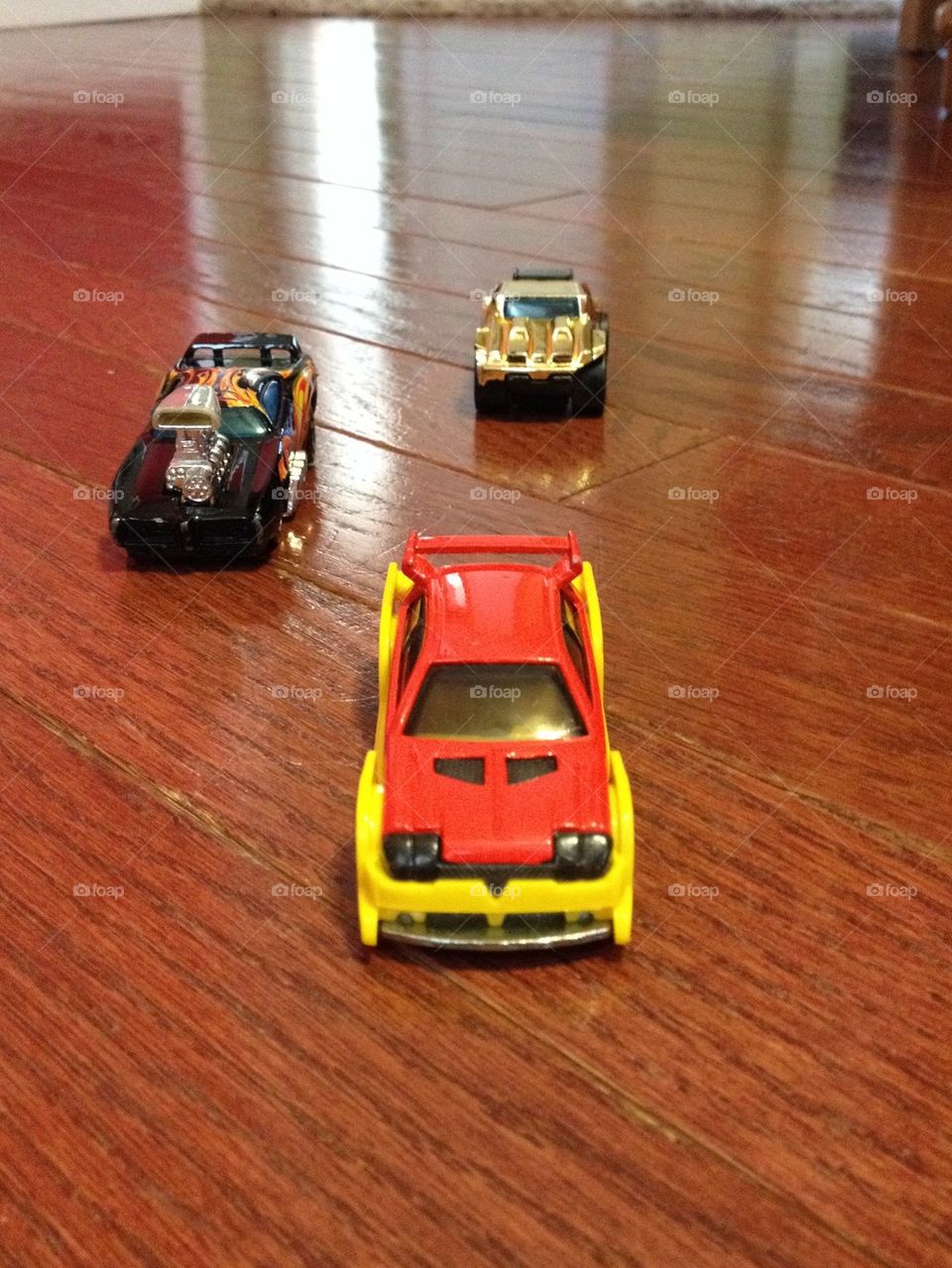 Toy Cars Aligned on Floor 1