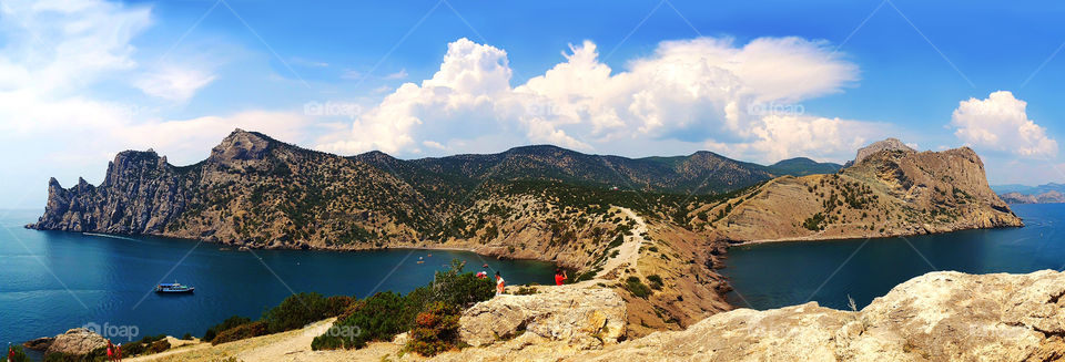 Enjoying the last summer days while hiking at mountains above the sea 