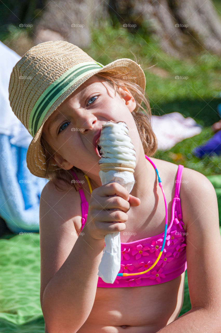 Young girl with cone ice-cream.