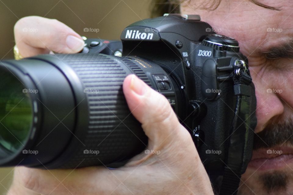 Getting the shot. Taken with a Nikon D5300 with Nikkor 70-300 kit lens, photo of my dad with his Nikon D300