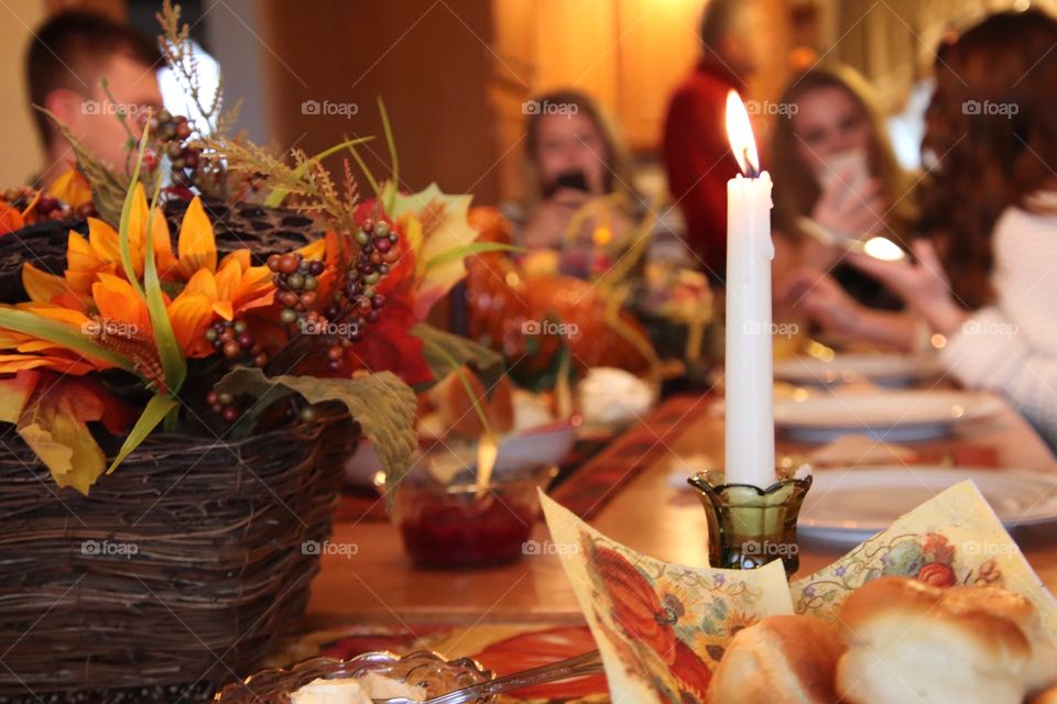 We always look forward to eating together.  Our family sitting at table ready to eat on Thanksgiving.